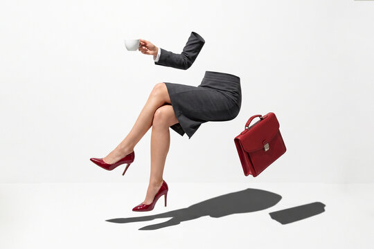 Invisible office worker with a levitating red leather briefcase and coffee cup