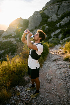 Trail Runner Drinking Water