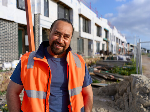 Maori Construction Worker Smiles at Building Site