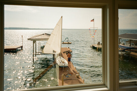 View window at  lake  Lake film and boy on dock