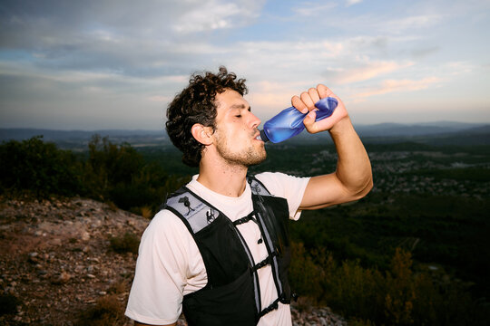 Trail Runner Drinking Water With On-Camera Flash