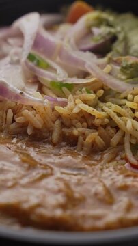 Aromatic Spiced Masala Rice Served with Rich Indian Curry and Fresh Sliced Onion Topping in a Bowl, Close-Up Food Shot.