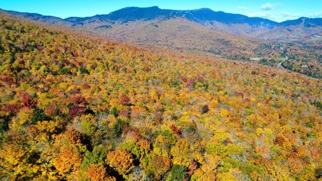 peak fall foliage in vermont from a drone