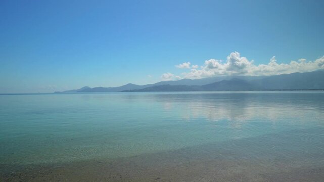 Calm Tropical Sea With Mountain Horizon