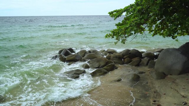Rocky Tropical Coast With Gentle Ocean Waves