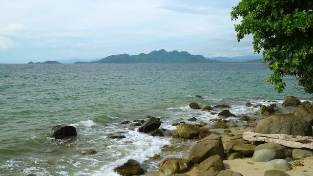 Ocean Waves Breaking on Rocky Tropical Shore