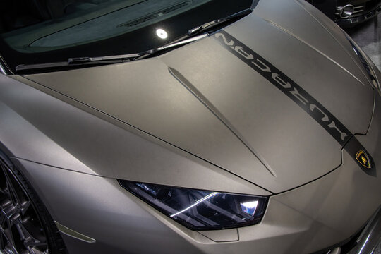 Lamborghini Huracan sports car displayed at a motor show.