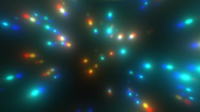 Colorful abstract lights drift across dark space, creating lively field of glowing bokeh. Blurred blue, cyan, red and yellow points shimmer and shift in dreamy, festive motion background.