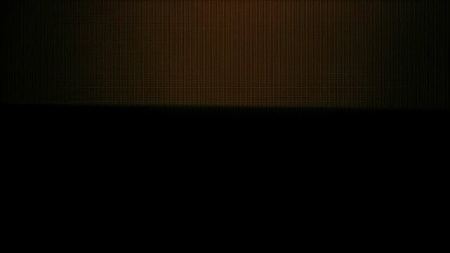 Authentic analog CRT display pulsing with electric orange strobe flashes, horizontal raster lines, and vintage screen distortion.