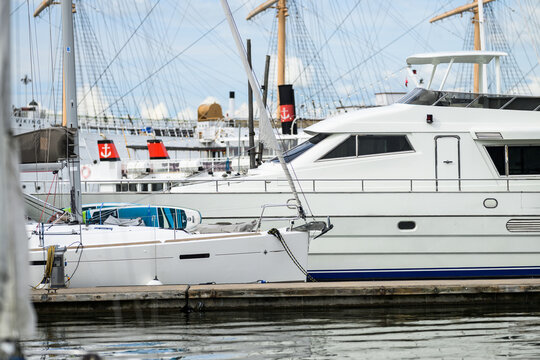 Gothenburg, Sweden - August 23 2026: White luxury yachts and sailboats moored in marina.