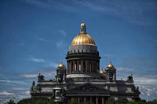 Saint Isaac's Cathedral golden dome against blue sky in Saint Petersburg, Russia