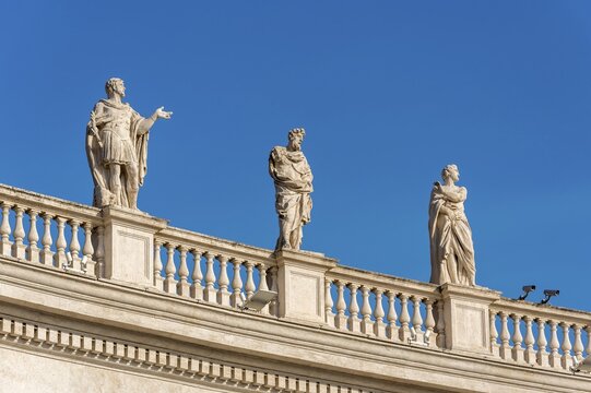 Statues of Saints Marinus, St. Eusignius and St. Marcian on Bernini colonnades, St. Peter's Square, Vatican, Rome, Italy