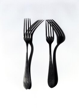 Two forks and their shadows