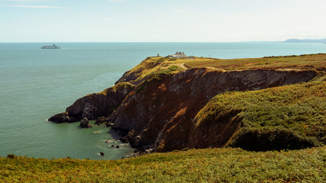 Coastal cliffs and grassy headland overlooking the sea in Howth Ireland