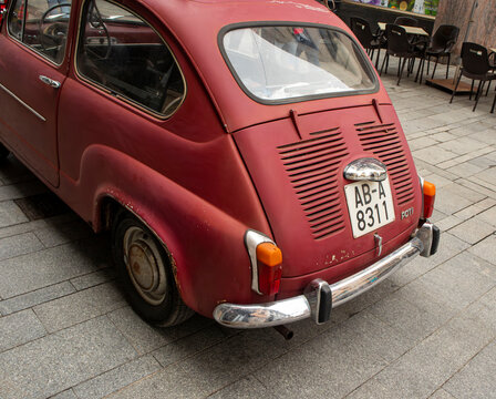 GANDIA, SPAIN - OCTOBER 4, 2026 Vintage red Seat 600 classic car parked on a stone paved street