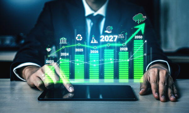 Businessman in Suit Analyzing Green Growth Charts on Tablet with Future Projections for Sustainable Development and Carbon Neutrality Leading to 2050 Sigmoid