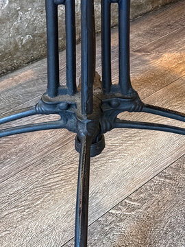 Iron foot of a vintage coffee house table