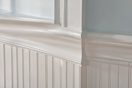 Traditional Cape Cod interior wall molding in a light-filled coastal home