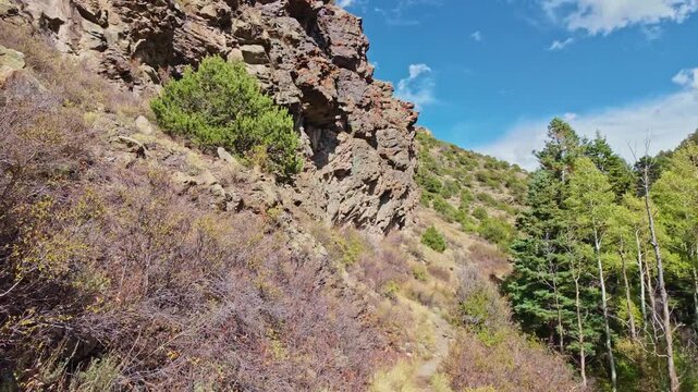Rugged rock formations flank the winding Mosca Pass Trail in Great Sand Dunes National Preserve
