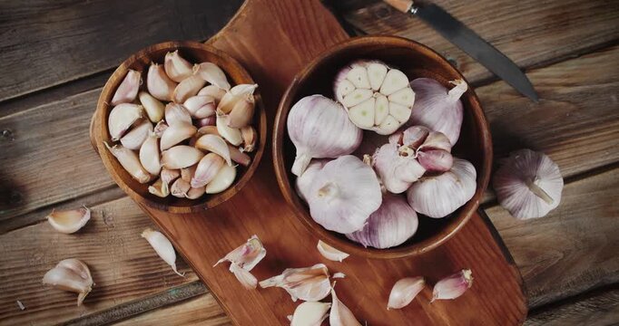 Close-Up of Fresh Garlic Bulbs with Brown Papery Skin, Healthy Natural Raw Vegetable Ingredient for Cooking, Food Preparation, and Diet
