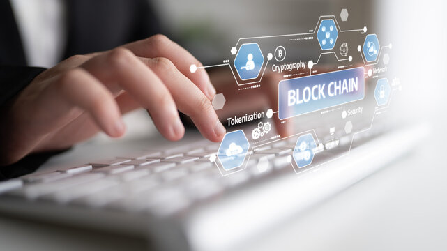 Professional using a computer keyboard with digital blockchain technology interface showing concepts of security, tokenization, and cryptocurrency applications. Tessel.