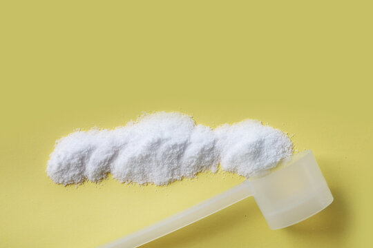 White creatine powder, used as a pre-workout supplement for gym and fitness.
