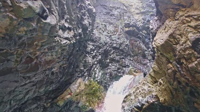 Zapata Falls plunging through rocky mountain close up