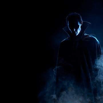 Mysterious Vampire Silhouette in Cape With Fog on Dark Background