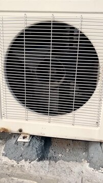 Spinning Air Conditioner Outdoor Unit Fan Working Close Up