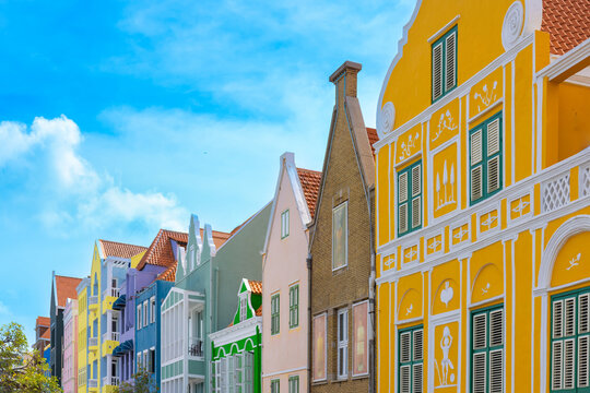 Vibrant painted building facades with shutters in the historic Punda district of Willemstad Curacao