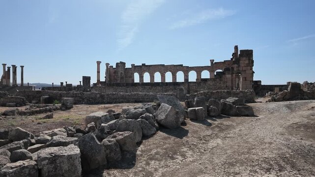 panoramic view archaeological foundations, stone walls, and distant valley landscapes at Volubilis, Morocco