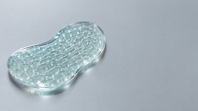 Translucent teal hydrogel eye patch isolated on transparent