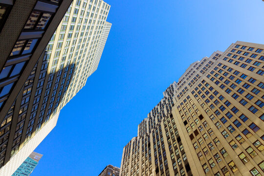 Buildings rise against Manhattan in an urban setting during construction New York