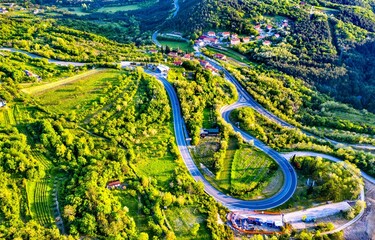 Fototapeta premium Aerial view of a winding road in the Dinaric Alps, Slovenia