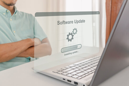 Virtual software update interface overlay on laptop with person waiting in background