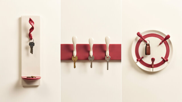 Three wall-mounted key organizers in white and red, featuring spiral hooks, a horizontal bar with hooks, and a circular plate with multiple pegs