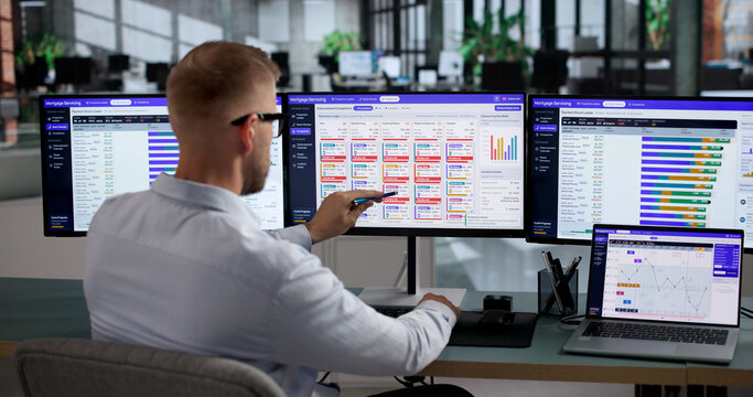 Mortgage Analyst Uses Laptop