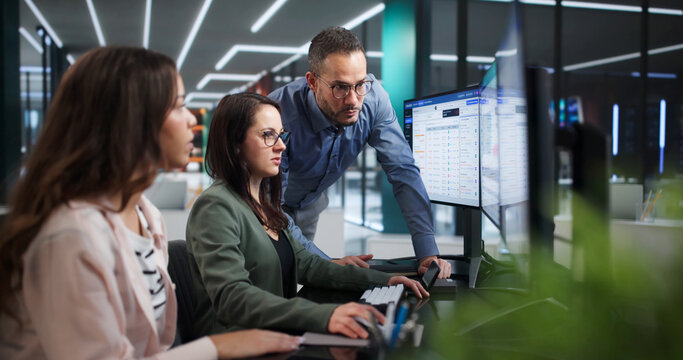 Financial Analyst And Diverse Team Discuss Cloud Cost Optimization Dashboard