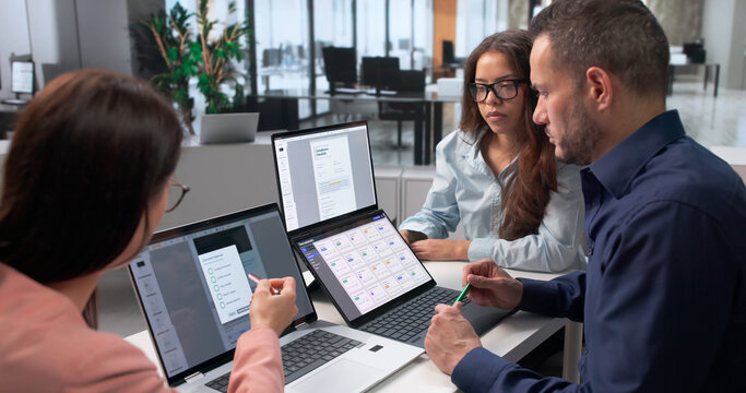 Project Manager Leads Diverse Team Reviewing Secure Digital Document Workflow