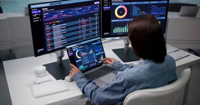 Cybersecurity Analyst Scans Network On Laptop, Detecting Risks
