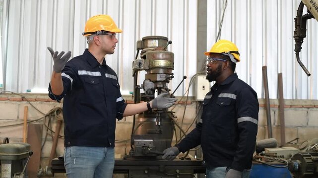 Engineer or factory worker wearing safety uniform under checking a metal part of lathe produce is quality control of parts machined on lathe structure Manufacturing industrial.	