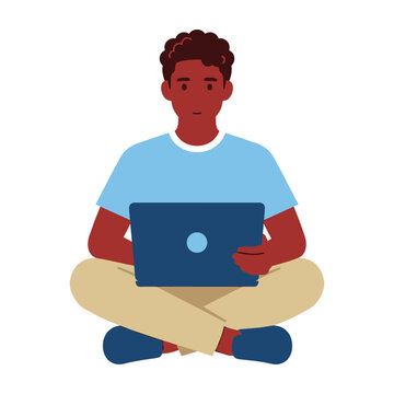 Young man sitting cross-legged with laptop on lap