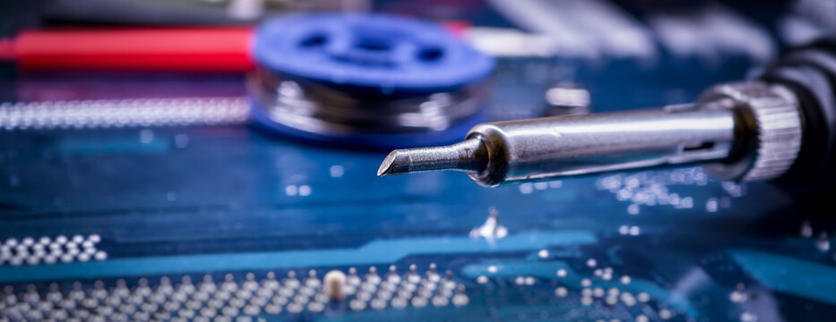 Soldering Tool on Printed Circuit Board for Electronic Component Repair and Computer Hardware Maintenance