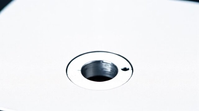 Video Effect Spring Roll Pin Compressing Into a Metal Hole