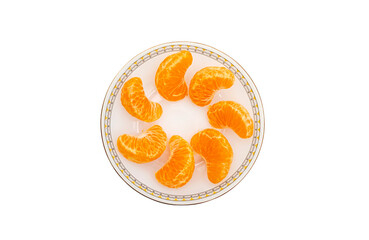 Top view of peeled mandarin segments arranged on a decorative white plate, isolated against a transparent background. © Mukta