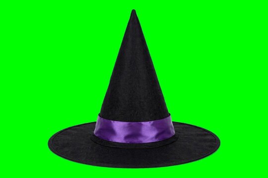 Black witch hat with purple ribbon on green screen, Halloween prop