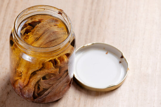 bottle of salted anchovies in olive oil