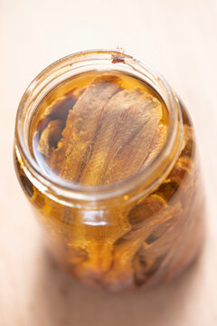 bottle of salted anchovies in olive oil
