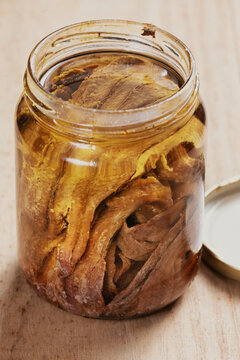 bottle of salted anchovies in olive oil