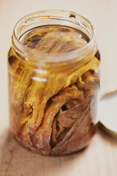 bottle of salted anchovies in olive oil